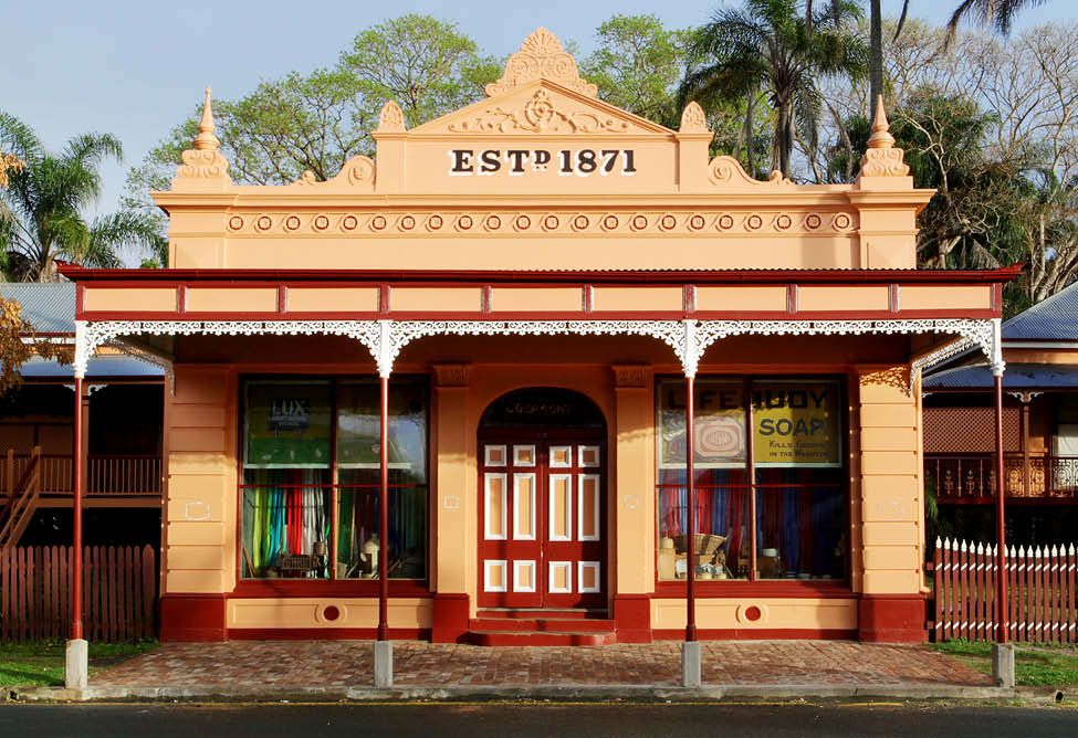 Historic building with EST 1871 sign and vintage storefront.